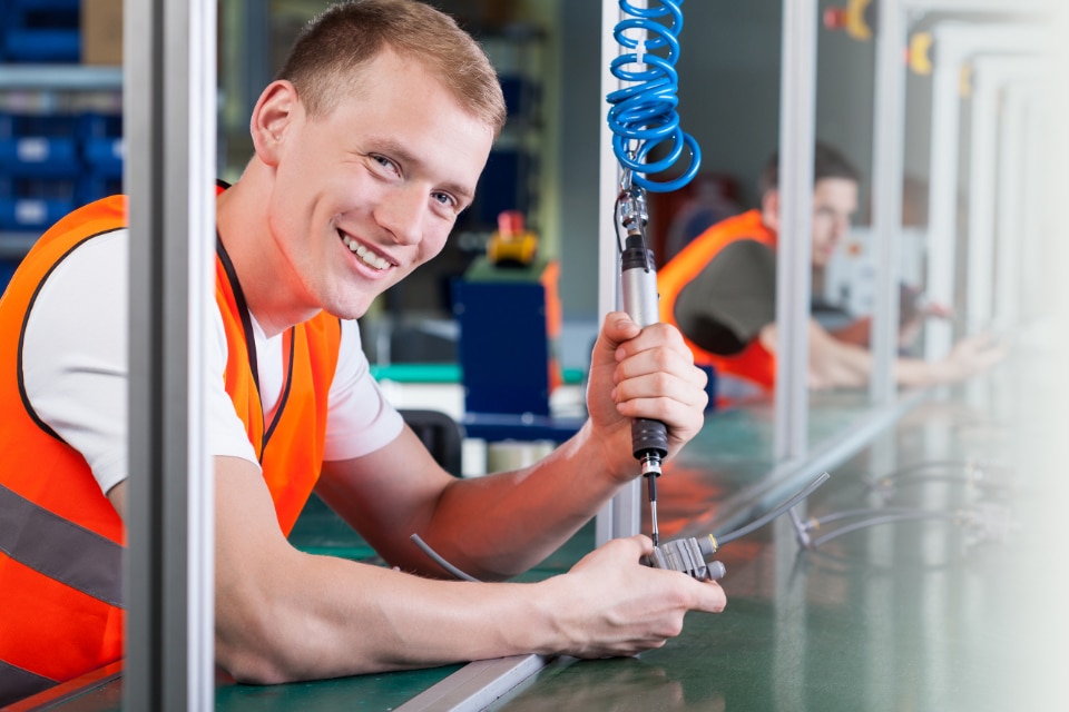 person doing sheet metal assembly